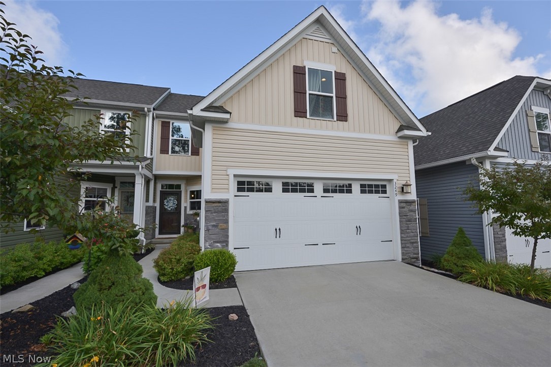 Welcome home to this beautiful, 3 BR, 2+ 1/2 BA, contemporary, townhome, just steps from Portage Crossing, located in the Woodridge school district, in the coveted Enclave of Old Mill Pond. Greeted by the meticulously maintained landscaping you will enter through the foyer into the new custom kitchen where no expense was spared. Open floor plan to spacious dining room. Great room with vaulted ceilings & views of the private, wooded backyard, boasting glorious sunsets. The first floor Owner's Suite features a large master bath with double sink and walk-in closet. The second floor has plenty of room offering 2 more bedrooms with walk-in closets & full bath. The walkout lower level has already been plumbed for a bathroom and is ready to finish if you would like additional living space and has plenty of storage as well. Make your own serene backyard Oasis with a doubled tiered walkout patio & deck awaiting your design. Additionally, this home boasts a first-floor laundry for added conveni