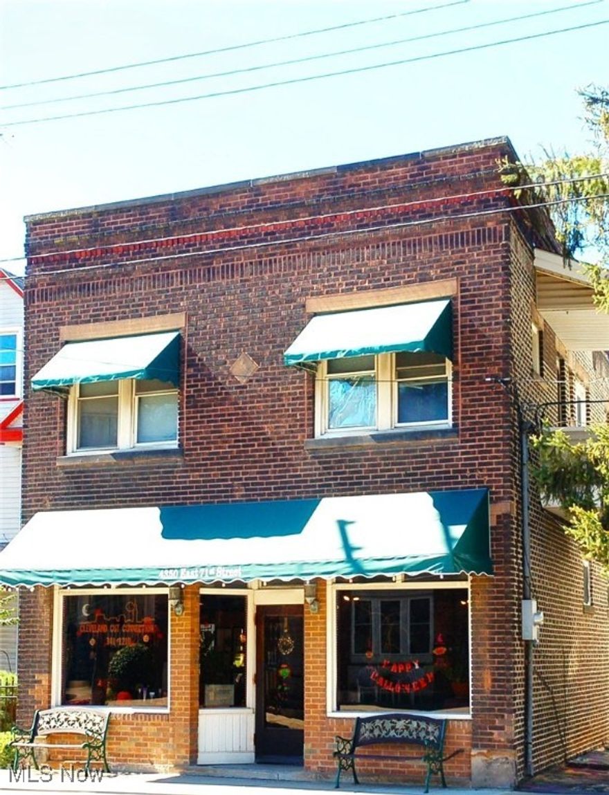 OPPORTUNITY AWAITS!!!  Hurry to see this extraordinary turn-key property that has large retail space + TWO apartments located in a beautiful area that is steps away from the Cuyahoga Heights border near I-77 (North and South) and I-480 (East and West) ~ minutes to Downtown. This Commercial, Mixed-Use property and Retail Store Front space, has an updated half bath.
In addition, there are two apartments each with a private entrance. The first floor apartment has 1 Bedroom, and features a full, updated Bath, a large, updated Eat-in Kitchen, a spacious Living Room, and a Porch. The second apartment, on the second floor, has 2 Bedrooms, full Bath, a large Eat-in Kitchen, a large Living Room, a spacious “Other Room” that could serve as an additional Bedroom, and Balcony. This 2nd floor apartment, with a long-term tenant, is spacious, updated and lovely with a comfortable feel. The Retail Space, has a dramatic 13 foot ceiling, perfect for moving your business to this great location, or starting the business you have been dreaming of. This retail space could be an Office, Coffee/ Sandwich Shop, Barber/ Beauty Shop, Grocery/Deli/Beverage store, and other options. This beautifully decorated Retail Space could easily be transformed into a third apartment. This property has been meticulously cared for by long-time owners.  It is fully air conditioned on both floors, has forced air gas heat, updated electric, newer floors, all windows have been replaced, there are 2.5 updated baths. The first floor apartment will have access to the partial basement, that is partially finished, with an enclosed room/office. There is an attractive shed at the rear of the property, and parking on the lot behind the shed.  Call for an appointment today!