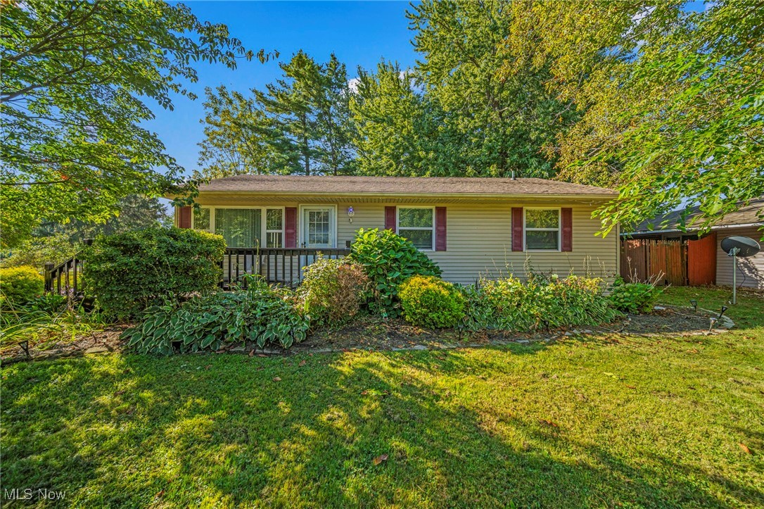 You don't want to miss this one! Sharp ranch with three bedrooms, full bath, and kitchen with dinette area. Enjoy the outdoors either sitting on your front porch or the back deck. Fenced yard, oversized 2 car detached garage, a "she shed" and another shed for storage. Schedule your showing today!