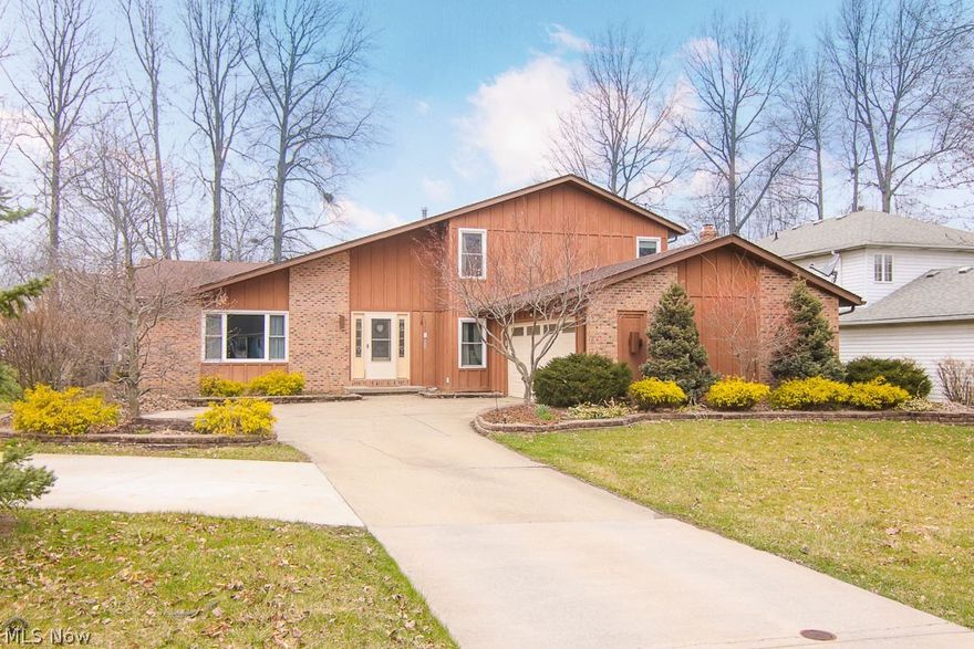 Welcome home to 7200 Timber Ln in Olmsted Falls OH.  This property is located in the township of Olmsted so you will not be subjected to RITA (local tax) here.  This spacious split boasts over 2700 square feet of living space with a wide open concept that is home to 4 bedrooms and 3 full bathrooms.   The first floor is home to a gleaming foyer, formal living room/dining room, eat-in kitchen and family room with a cozy wood burning fireplace, full bath and first floor bedroom.  Second floor has a huge master suite with separate vanity area, walk in closet and updated master bath.  Their are 2 additional bedrooms on this floor and they share a bathroom that has also been updated.  Pergo wood flooring in all bedrooms and main living areas of the home.  Partial basement has nature stone floor and is a great storage space.   Off the kitchen is a 3 season sunroom that walks out to the deck/ outdoor entertainment area.  The yard is home to many perennials that bloom all year long.  Olmsted Fa