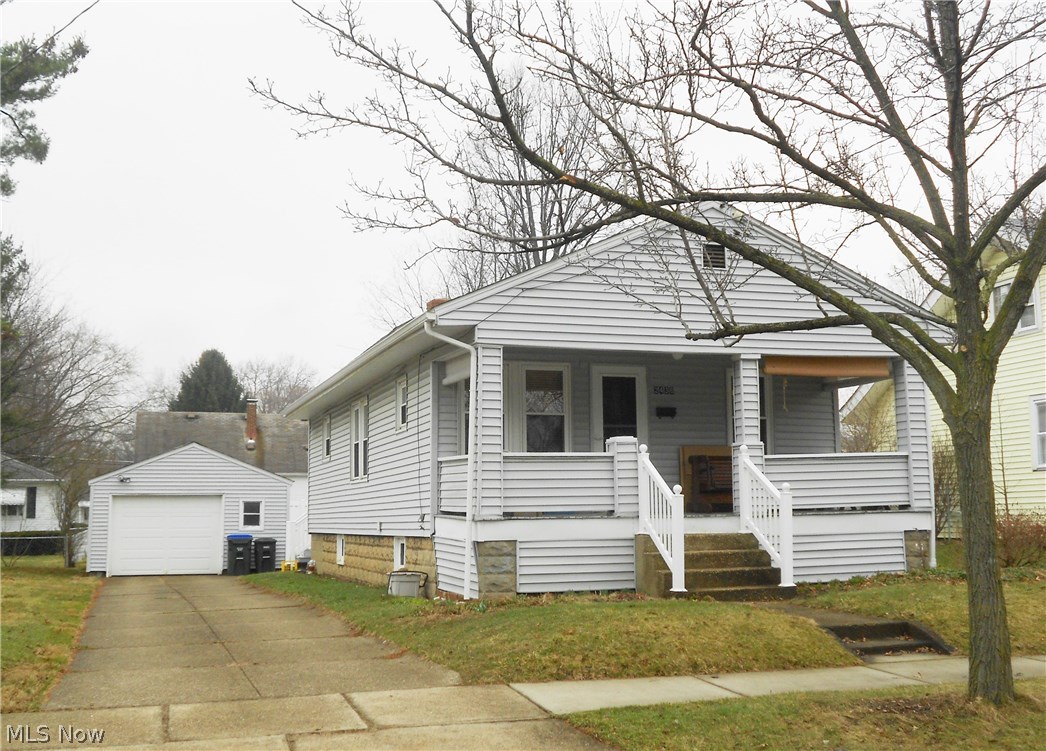 Warm, charming and inviting two bedroom ranch in prime location, close to parks, library, shopping and schools! This home sits on an extra wide lot, offers an eat-in kitchen with plenty of cabinets and counter space, plus a newer kitchen floor with the look of wood. A dining room with a built-in hutch, solid wood doors throughout and vinyl tilt-in windows for easy cleaning add to the appeal of this home. Outside you will find a maintenance free vinyl deck perfect for entertaining family and friends and the backyard is totally fenced in with a 6’ high white vinyl privacy fence. Adding to your outdoor enjoyment is the large front porch that faces east and spans the length of the house. Other updates include the newer roof and newer automatic garage door. A home warranty is being offered for peace of mind.