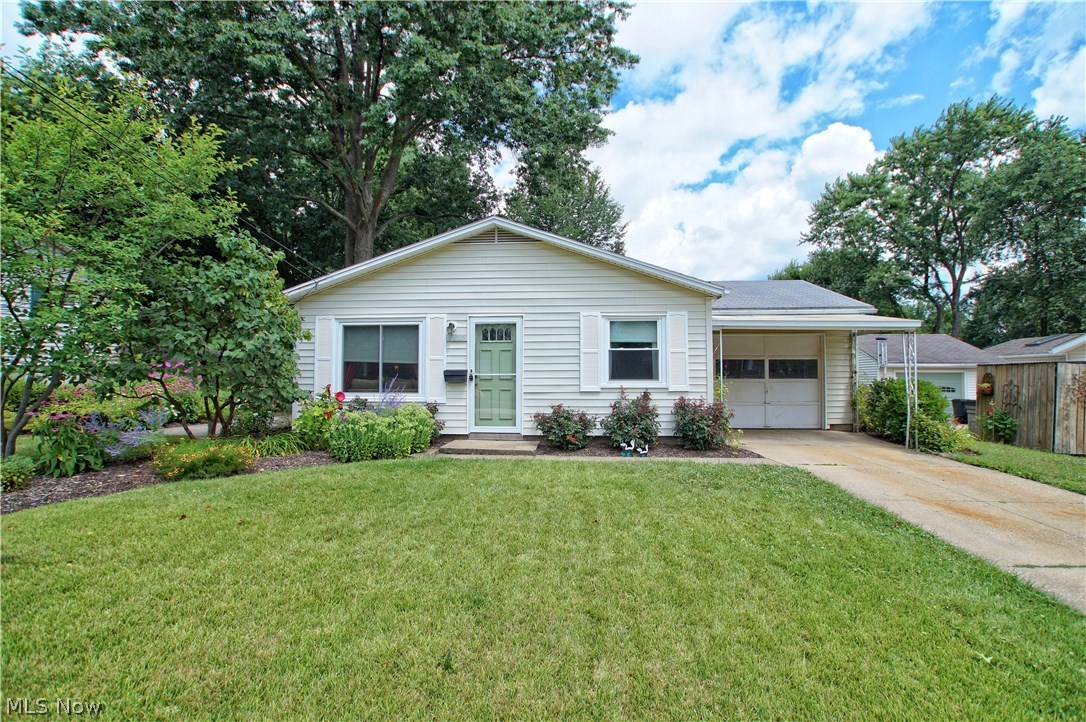 Nothing to do here but move right in!! Beautiful Ranch starter home with fresh paint, newer laminate floors, carpet, light fixtures and interior doors, newer remodeled kitchen. Gorgeous 3 seasons room leads to large fenced in backyard. that is nicely landscaped. Attached by breezeway 1 car garage. 3 bedrooms, 1 full bath. Bathroom has been completely remodeled with new vanity/sink, flooring, and new tub/shower with tile surround including mosaic inlay. 1 year home warranty offered for your convenience.
