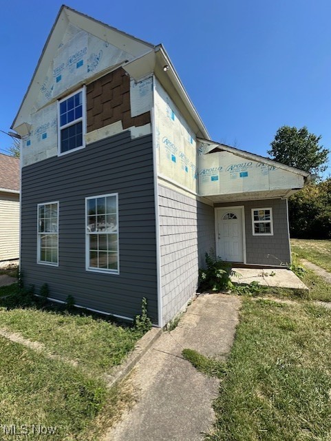 Investment Alert! Seize this golden opportunity to finalize a partially renovated gem. The heavy lifting is done: gutted interior with new framing, electrical, and plumbing already in place. Partially completed siding, new shingles, flooring, toilet, tub, tubing and bathroom included to complete your vision. Add your finishing touches and watch your investment grow!