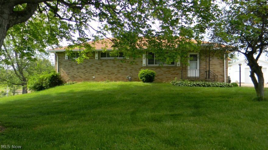 The home sits on a 3.3 acre lot with a 30' x40' out building.  Brick 3 bedroom 2 bath house: New roof in 2006.  New windows in 2007.  With some updating and improvements this will make a great country home.