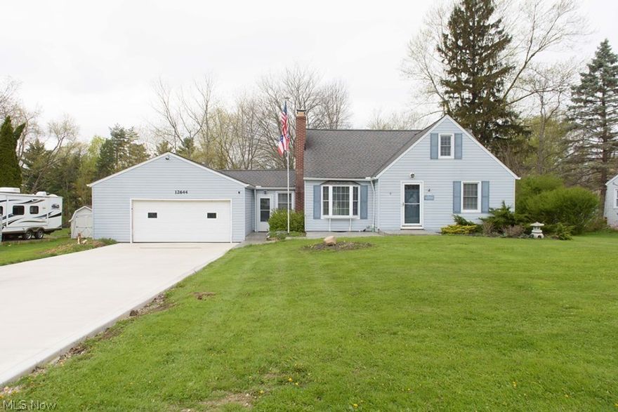 Chesterland!  Beautiful, Updated, 4 Bedroom, 2 Full Bath Bungalow. Amazing Kitchen and dining area with Quartz Countertops, upscale white cabinets and GE Profile Black Matte Stainless steel appliances.  New beautiful sliding glass door leads to an awesome deck and above ground pool that your family and friends will love. First floor Living room with wood burning fireplace, bedroom/office and full bath,  and 3 bedrooms and 1 full bath on 2nd floor. Large 2 car garage with heated breezeway with over 1/2 acre of land but close to all Chesterland amenities!  This is a must see!!!