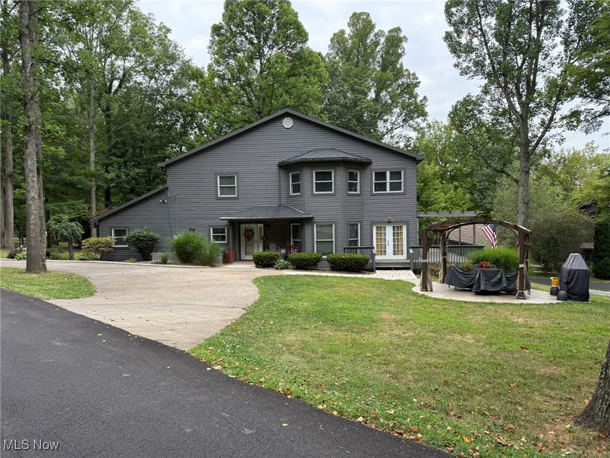 Fantastic lake home, perfect for year round living or your weekend retreat.  Beautiful setting, just a stones throw from the water.  Spacious vinyl sided home with 4 bedrooms and 3 full baths.  Natural sunlight fills the great room with abundant windows and French doors to the wrap around deck. Updated white kitchen features a pot filler and island breakfast bar.  The kitchen opens to the dining room with hardwood floors and electric fireplace that has access to the 24 X 11 screened porch boasting tongue and groove cathedral ceilings.  .  Sliding French doors lead to the main floor office which could serve as a bedroom.  The second floor master suite features pocket doors to the full bath with ceramic tile shower.  Three additional spacious bedrooms and full bath are located on the second floor.  Oversized 2 car attached garage.  2 gas furnaces and 2 central air units.  Corner lot includes gazebo with concrete patio.  Includes a private dock on the water.  Seller is offering an allowance for living room carpet.  MWCD lease fee of $2,343 for 2025.  MWCD lot A9.  Current owner's utilities average $50 for gas, $250 for electric & $52 for sewer monthly (based on full time living).  Room sizes are estimates.