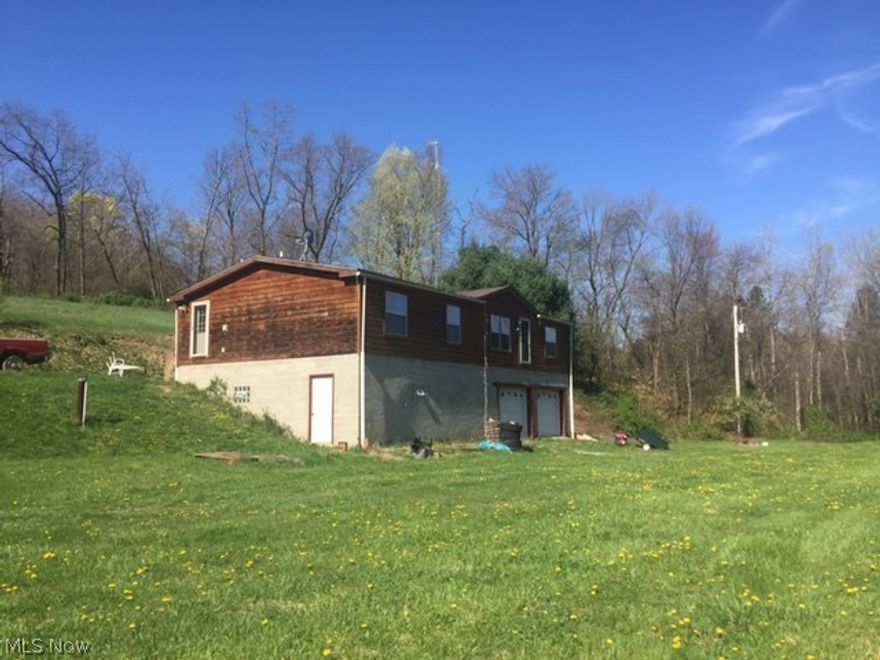 Private setting, 5 acres in BLSD. 2001 3BR 2 full bath manufactured home that sits on a concrete basement/garage. Nice wood interior beams throughout the LR, open floor plan with a fireplace.  Make your appointment to view this home.
