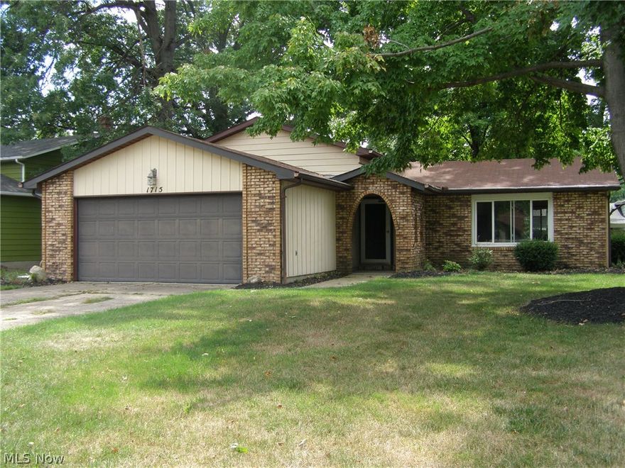 Astounding 3 bedroom 2 full bath split level in Lorain with Amherst schools with all updated windows. Walk in to the open concept living room, dining room, kitchen. Walk down to the extremely large L shaped family room with wood burning fireplace. Plenty of storage inside, also has built ins for storage in the garage. Walk out the sliding door from the kitchen to a nice patio overlooking the yard with mature trees and and partially fenced with a privacy fence.