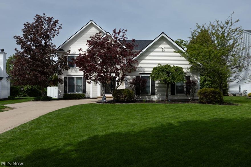 Welcome to this beautifully maintained 4-5 bedroom, 3.5 bath Colonial in the highly desirable Olmsted Falls community, offering a private backyard oasis complete with a heated in ground pool, lush landscaping, and expansive deck for effortless outdoor living.
From the moment you arrive, the custom designed front entry and side car garage create a distinctive and highly sought after presence. Step inside to a dramatic two story center hall foyer featuring cherry laminate flooring, soaring cathedral ceilings, and an open staircase leading to a catwalk style upper level, filling the home with natural light and an inviting sense of space. The main level offers a functional layout designed for both everyday living and entertaining. The eat in kitchen has been refreshed with LVP flooring, painted cabinetry, modern hardware, and a pantry, opening seamlessly to the family room highlighted by a striking gas fireplace with ornate stamped surround. A formal dining room with updated lighting provides the perfect setting for gatherings.
Upstairs, the spacious primary suite features vaulted ceilings, an ensuite bath with soaking tub, shower, and a walk in closet. Three additional bedrooms are complemented by a fully updated bath, offering flexibility for family, guests, or home office use. The finished lower level adds exceptional living space with a large media room, built ins, wet bar, additional rooms, and a renovated full bath, ideal for entertaining or extended living. Step outside to a fully fenced yard designed for relaxation and enjoyment. The heated 16 by 32 pool features a diving board, newer liner and gas heater, surrounded by a wooden deck, thoughtful landscaping, and green space. Major updates include a new roof in 2025, furnace and air conditioning in 2026, updated baths, pool equipment, garage door opener, and numerous interior improvements.