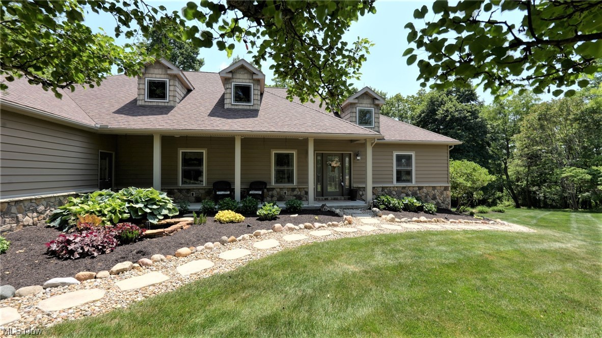 Amazing 5 bedroom, 3-1/2 bath contemporary home on a beautiful wooded lot. Soaring ceilings & s tone fireplaces. Gorgeous kitchen with Corian counters, stainless appliances, skylights and pantry. Top of the line appointments and great décor. Two laundry rooms. Finished lower level with 2nd kitchen. Gas heat, public water, generator, on demand water heater, 3 car heated garage, nice deck. 2 stall barn with tack room. Professional landscaping with small pond with fountain. Covered back porch.