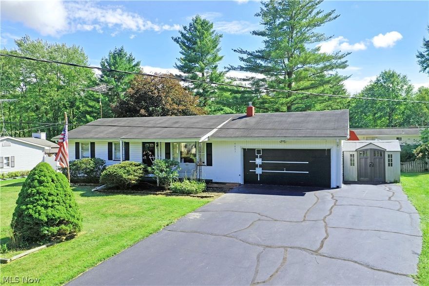 Take a closer look at this prominent Newton Falls ranch, you won’t want to miss the huge potential of this fresh on the market estate! Offering a spacious three-bedroom layout and a fenced in backyard with an oversized deck to include a covered dining area, this home checks all the right boxes. Spend your summer evenings relaxing on the front patio or step inside to find a welcoming, carpeted living room with its large picture window. Around the corner, the combined dining and kitchen opens to reveal an array of stained wood cabinetry with a delightful, tiled brick backsplash and sweeping countertops. A brightly lit full bath is located a mid-hall before branching off into the three spacious bedrooms. The larger master suite includes its own private half bath with room for a stall shower upgrade. Down below, the impressive basement brings workshop and storage space along with laundry and utilities. The finished garage gives an added bonus with its multiple cabinets and wood finished wa