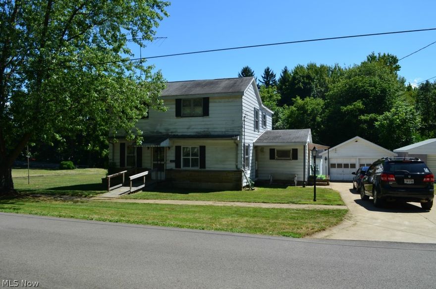 Location,Location,Location Bring your paint brush, this 4 bedroom 1.5 bath has enough room for the whole family. There's a master bedroom along with a office on the first floor. For the car buffs there is a 2 car garage along with a 24 X 24 garage workshop. Great landscape yard including a side lot. Not a drive by