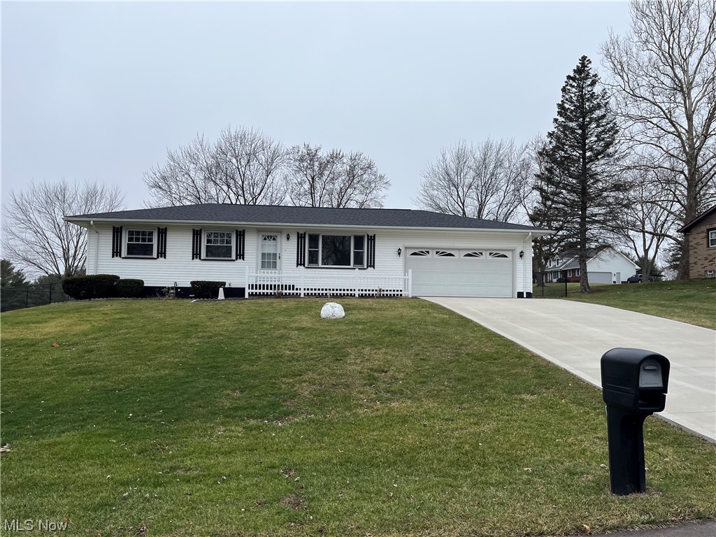Welcome to this beautiful ranch home located in Perry Township! As you pull up to the house you will notice the nice long cement driveway that leads up to the two car garage that includes two man doors. One door provides access to a large backyard that was recently enclosed with a black vinyl coated chain link fence that provides a great space. As you enter the front door, you are greeted by a living room with a large front window that lets in plenty of natural light. Just off the living room, is a dining room with another large window. There are 3 bedrooms and 1 recently renovated full bath with a new vanity, toilet, walk-in shower, and flooring. The kitchen features beautiful tile floor, white cabinets, and a ceramic backsplash. Kitchen also includes a gas stove and refrigerator. This home has solid oak doors, trim, and flooring throughout. Some updates include: recently painted walls and ceilings, all carpets have been removed, new roof installed 2022, and a new cement driveway and asphalt skirt installed 2023. The basement has a large work shop, shower, washer/dryer hookups and plenty of room for additional finishing. This house is move-in ready in the desirable Perry Local School District