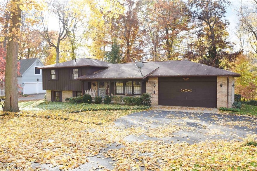 Custom-built one-owner home built by Noah Troyer, one of Tuscarawas County's leading builders of the time. Quality features include brick exterior, Pella windows, Schrock kitchen with breakfast bar and Dutch pantry plus Schrock bath cabinetry, well-fitted oak trim, beautiful bay window and beamed ceiling. Excellent floor plan with spacious family room offering a full brick feature wall and a wonderful wood burning fireplace with raised hearth (plenty of firewood included in the sale). You'll be so toasty on those blustery winter's evenings. Home is well insulated. Convenient second stairway to the basement from the garage. Beautiful wooded lot, enclosed rear patio, big 2-car garage, shed. Excellent location among fine homes, easy access to Dover, Canton and I-77. No money down USDA Rural Development financing available for qualified purchasers.