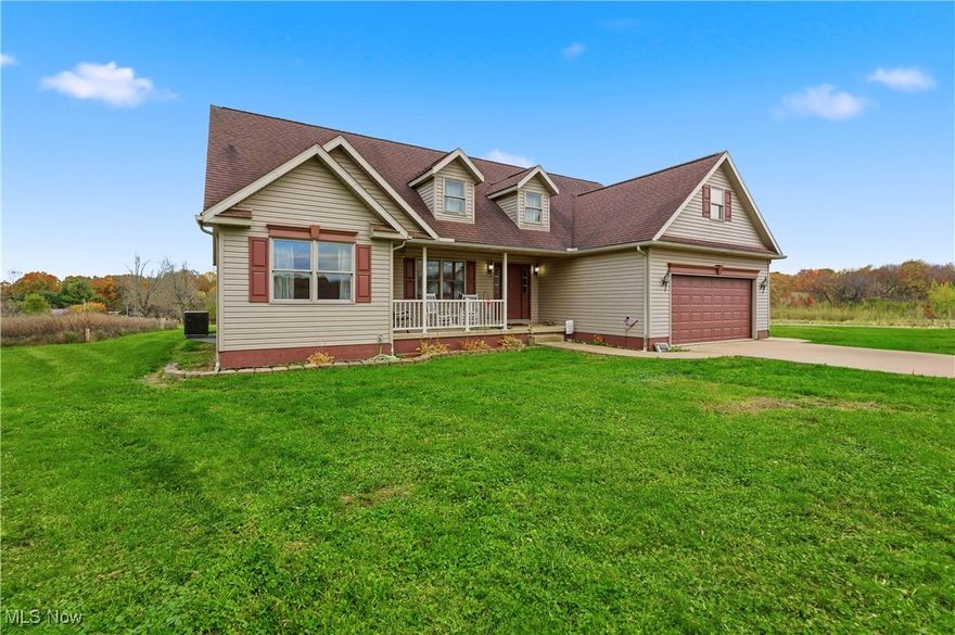 Fantastic 10.69 acre mini farm featuring a beautiful 3 bedrooms, 2 full bathroom ranch style home built in 2006 with a 2 car attached garage and an awesome 54' x 83' outbuilding/shop that is heated, has a full bathroom, an office, four 14' overhead doors and more. The main level of the house has an open floor plan with a large great room, a kitchen with plenty of cabinet and countertop space, tile back splash, an island and breakfast bar, a formal dining area and a 4 seasons sunroom with a sliding glass door leading to a cement patio overlooking the property. The spacious owner's suite features his/her closets and a private en-suite bathroom. There are 2 more ample sized bedrooms with laminate flooring and another full bathroom. There is a convenient 1st floor laundry room as well. The full basement is ready to be finished with the potential to add more usable living space, has a high efficiency forced air furnace, A/C an offer's plenty of room for storage. The 54' x 83' heated outbuilding is very impressive and has so many possibilities as an at home business, large truck storage or for your personal use. The acreage is cleared, flat and could be used for crops, pastureland for animals or both. This is a wonderful property that has so much to offer.