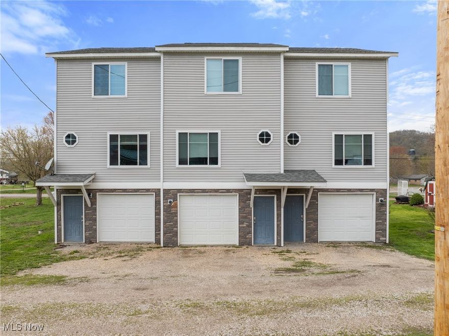 This newer construction triplex offers a fantastic opportunity for investors seeking dependable cash flow and minimal maintenance. Each of the three units is a 2-bedroom, 1-bath layout with its own laundry hookups and a 1-car garage. The property has been well maintained since completion in 2018, offering modern systems and energy-efficient design that keep operating costs low. All three units are currently leased: Unit 1A rents for $1,150 per month, Unit 1B for $1,250, and Unit 1C for $1,150 — each including trash service and water (up to $89/month). Tenants also enjoy open-concept living spaces, updated kitchens with sliding doors to private decks, and individual garage access from the lower level. With limited upkeep required, strong tenant history, and a convenient location close to local amenities, this property checks all the boxes for a hands-off, income-producing investment.