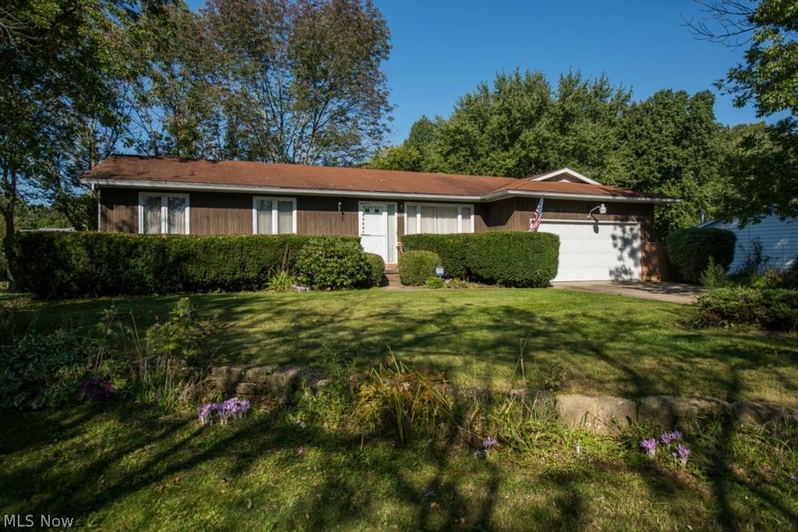 With a little TLC, this 3 BR ranch will make a great home!  Situated in a park like setting and across from Nolley Elementary School, the home features a living room, dining room and family room with a wood burning fireplace, with access to the large deck and 2 car garage.  There is another door off of the dining room that also leads to the back yard.   The master bedroom has access to the 1/2 bath and all bedrooms share a full bath.  Outside you will love the deck that overlooks the huge, level back yard with mature trees and a storage shed.  So many possibilities!