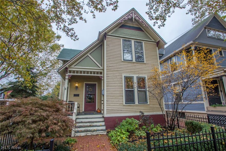 Rare double lot in the heart of Cleveland's hottest neighborhood, Ohio City. Welcome to 1743 West 32nd, located across the street from the greenspace, beautiful Fairview Park. This home will have you from the moment you enter. The original wood staircase in the front foyer is something to behold and will draw you into the rest of the home wanting more. 1870's original top nail wood flooring  carries through from the front dining room and into the living room. The newly remodeled kitchen was opened up further to blend with the living room. It features subway tile, new counter top, tile floor and new white cabinets. At the rear of the home is the cozy family room featuring built in book cases and an entertainment stand, rustic pine floors and sliding patio doors that lead out to your private deck which overlooks the large fenced in back yard. The master large bedroom features two large closets and a tastefully done master bath. The master bath is finished with subway tile around the deep