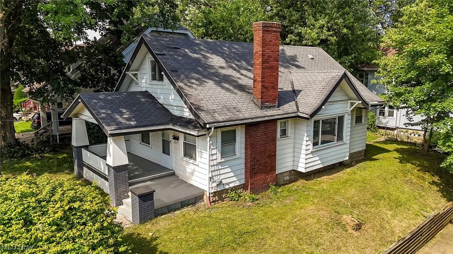 a beautifully renovated home in North Akron close to the border with Cuyahoga Falls. The newly remodeled kitchen features beautiful porcelain and glass tiles, new with cabinets with a dramatically contrasting countertop, a deep bathtub, new knighting and a new window.  The modern flared living room has newly installed spot lights, while the remodeled fireplace features an electric heater framed by elaborated mosaic tiles.  The interior gas been freshly painted while a range of new flooring installed throughout the home.  The recently installed HVAC system offers the new owners a peace of mind for the foreseeable future.