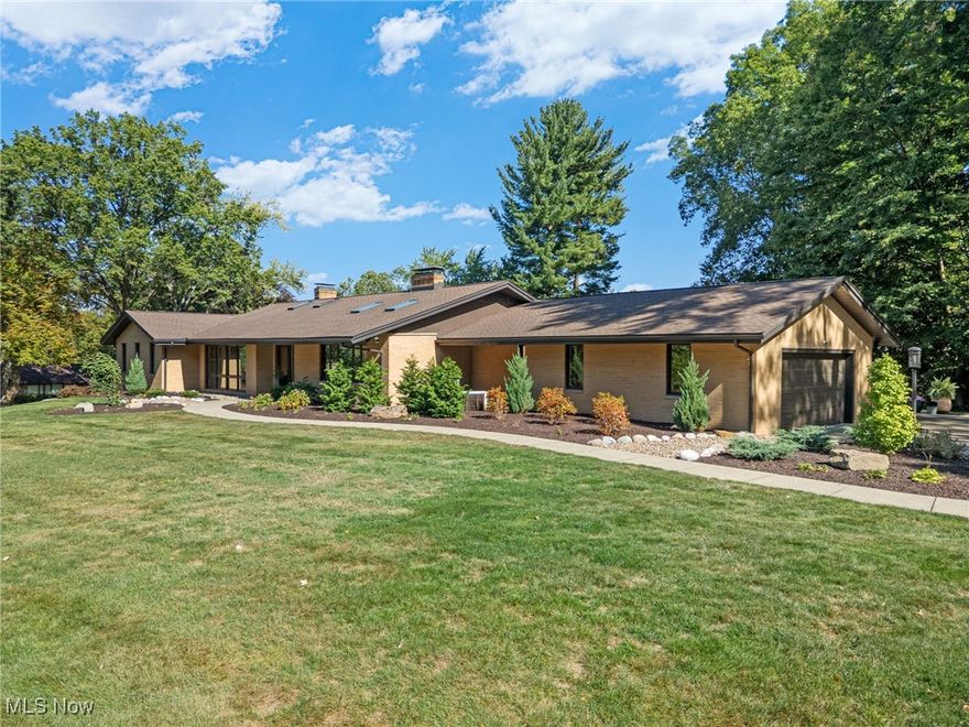 This one-of-a-kind mid-century modern ranch blends timeless style with today’s comforts. Offering 3 spacious bedrooms including a beautifully updated primary suite, 2.5 bathrooms, and over 3,000 sq. ft. of living space, this home delivers room to live and entertain. Natural light pours through large windows, highlighting the home’s signature sunken living room—a true conversation piece—anchored by one of the property’s two fireplaces. The tastefully updated kitchen features sleek quartz countertops and modern finishes while still complementing the home’s original character. Sitting on a corner lot just shy of an acre, the setting provides both space and privacy in one of Canton’s most desirable neighborhoods. This rare opportunity to own a classic mid-century modern gem in Market Hills won’t last long, let's set up your private tour today!