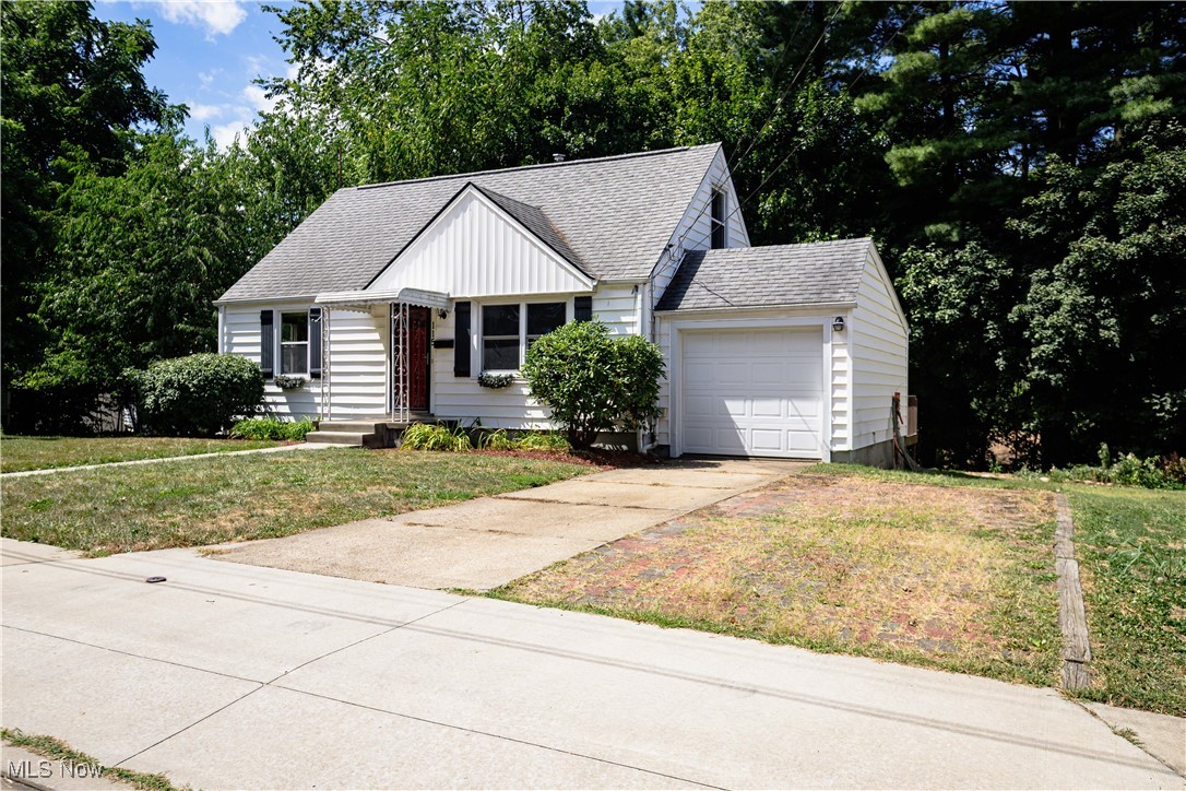 Very well kept 3 bedroom, vinyl sided bungalow conveniently located in North Canton. The main level features a spacious living room with beautiful hardwood floors, an updated kitchen with plenty of cabinet and counter top space, tile backsplash and stainless appliances, 2 nice sized bedrooms with hardwood floors and an updated full bathroom. Upstairs has a huge bedroom with plenty of closet space. The full basement is partially finished having a carpeted rec room, another bonus room with vinyl flooring, glass block windows and plenty of room for storage. Other features include an attached garage with opener, a large deck in the back of the house that's perfect for entertaining family and friends, a storage shed, a cement driveway with additional parking area, vinyl replacement windows, gas forced air furnace, A/C and more. This wonderful home is located within walking distance to the beautiful West Park and there is nothing to do but move in and enjoy.