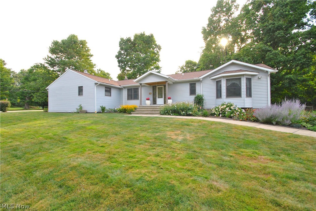 Much to offer in this ranch style home with full basement. Enjoy the perennial gardens on your way to the covered front porch. Entering you will see the vaulted great room with new carpet & gas fireplace, formal dining room with large windows & wood floors, and eat in kitchen with loads of cabinets, walk in pantry with window. French doors in the kitchen lead to large back deck & yard. Effective year build 2001- full reno. See sizes of owners suite, bath, closet and laundry! Owner suite has wood-burning fireplace, bay window, bath with dbl vanity, jet tub, glass/tile shower, and walk-in closet. Additional bedrooms have large closets, lots of windows, lighted ceiling fans and can lighting. Hall bath has dbl vanity and door to private toilet and shower. Laundry room with office/craft desk, sink and wall of cabinets. Foyer with wood floors features an open staircase to LL family room flex space. Perfect place for movie/game nights. Stone gas fireplace, built in media wall and granite bar