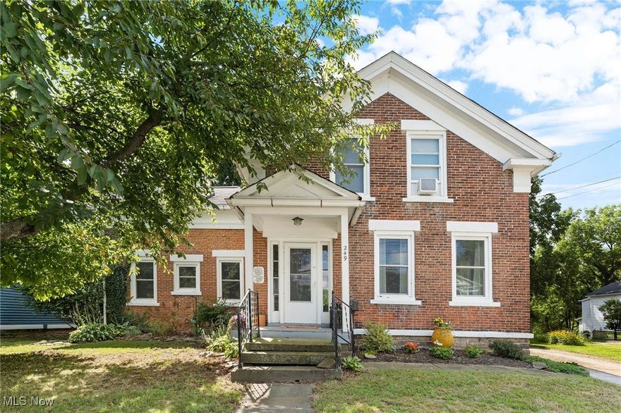 Welcome to 249 W Main St. – This beautifully updated brick-front colonial combines historic charm with stylish modern touches, creating a home that feels both elegant and inviting. From the moment you arrive, the brick façade accented with crisp white details sets the tone for a classic yet contemporary look. Step inside to a spacious living room filled with natural light, highlighted by large windows, built-ins, and a soft white-and-gray palette that gives the space a peaceful, welcoming atmosphere. Flowing seamlessly from here is the cozy dining area, featuring rich wood floors and charming built-ins—perfect for family dinners or hosting friends. The kitchen is a true showstopper! Designed with both beauty and function in mind, it features striking darker wood-look vinyl flooring, an exposed brick accent wall, stylish lighting, ample cabinetry with built-ins, and stainless steel appliances. A central eat-in space provides the perfect spot for a quick breakfast or morning coffee, while windows flood the room with natural light. Also on the main level, you’ll find a versatile den and a separate office, offering flexible spaces for work, study, or relaxation. A convenient half bath and laundry area complete the first floor. Upstairs, you’ll find four bedrooms thoughtfully laid out for comfort and privacy. The primary suite offers a relaxing retreat with its own en-suite bathroom, while an additional full bathroom serves the secondary bedrooms. Additional updates include 20 brand-new windows, ensuring energy efficiency and abundant natural light throughout. Step outside to enjoy a large deck overlooking the private, tree-lined backyard—a perfect spot to relax, entertain, or enjoy summer evenings. The yard offers plenty of room for gardening, play, or family gatherings.
This move-in ready home blends character, comfort, and modern updates in one exceptional package! Don’t miss your chance to own a true Madison gem—schedule your showing today!