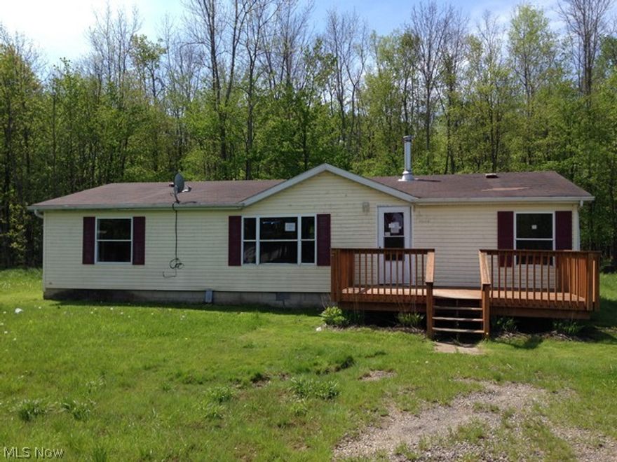 Looking for something out of the way in the country?  Here is affordable living with nice acreage!  Open floor plan inside, wood burner, 3 bedrooms and 1 bath.  Usable outbuilding for what ever needs you may have.  Take a look today before it gone!