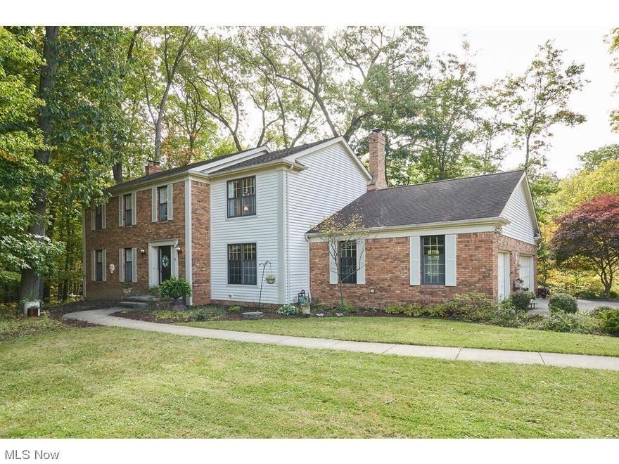 Wonderful quality built one owner home up against Cuyahoga Valley National Park in Bath Township with Richfield mailing. Call to see this 4 bedroom 2 full baths, 2 half bath home on the quiet culdesac  with wooded ravine backyard and the National park on the east side of property. This lovely home is custom built with hickory floors in Foyer and dental crown molding. The living room and dining room are large and  both have crown molding. The Kitchen has cherry cabinets with the eating area the opens to a lovely deck, patio and quiet views of their wooded sanctuary. The family room is off the eating area  with a wood burning fireplace, a wet bar, plus built in bookcases and a beam ceiling. Also on the first floor are 2 half baths ,one off the foyer and the other one located off the first floor laundry. Across from the family room is a first floor den too. The upstairs boosts 4 large bedrooms. The master has French doors that leads to a private second floor deck. The master bath has a walk in closet, dressing table. The partial basement is unfinished and a walk out to the backyard.