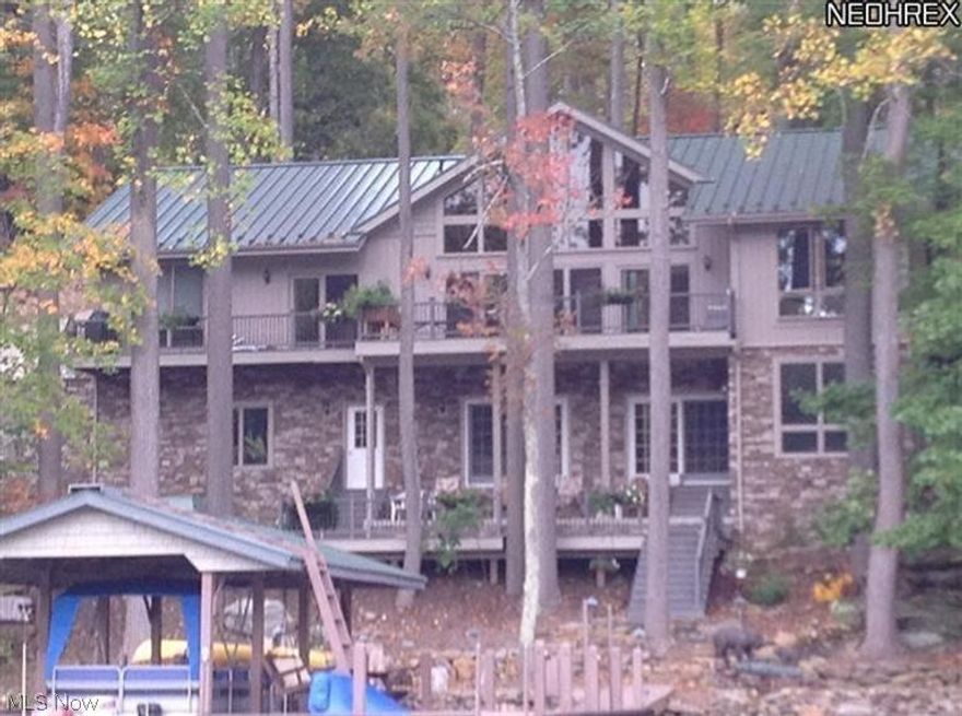 LAKEFRONT Home w/ Metal Roof&Geothermal Heat is only 50 feet from the lake's edge. This also is one of the nicest homes at Lake Buckhorn!!! Though built in 1970, it was expanded & greatly renovated in 2008 by Frantz Bldr. Warm home w/ stone & vinyl shake exterior, Quartz Countertops, Walk-In Pantry, 2 Large Cultured Stone Fireplaces (both w/ efficient woodburning inserts w/GLASS Doors, 4 Bedroom, 3 FULL BATH, 1 Half Bath home. Home features OPEN Kitchen w Breakfast Bar overlooking the Lake & Family Room w/4 pairs of 8-ft Sliding Doors to the Lakefront Deck that frames the lake views, TWO FIREPLACES, cement driveway, Master on main level LAKESIDE(private Master Bath) that walks out on to a 10x27 deck. Split bedrooms on main level allows privacy. Lower level is gorgeous & WALK-OUT. It has a 2nd Family Room w/2nd Stone Fireplace(w/insert). Also has 30x12 Game Room. Ultra efficient GeoThermal Heat($168/mth), 3 Car Garage + 30x24 Detached Heated Shop (Radiant Floor Heating)w/ Half Bath WOW!