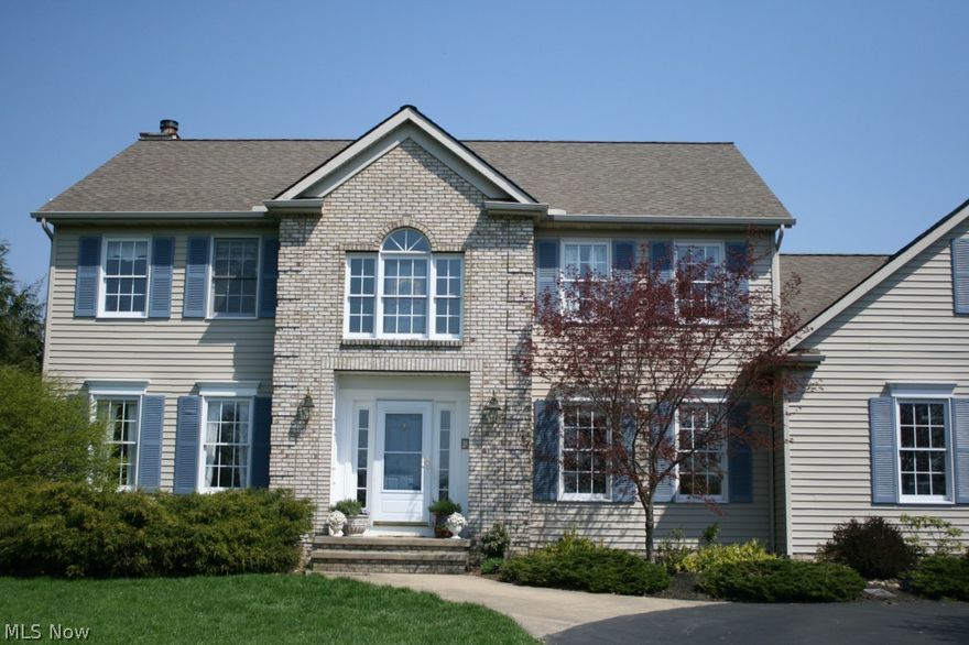 Elegant Colonial set on 1.37 Acres. This home has great views and loaded with fine custom upgrades. Eat in kitchen has granite counter tops, stainless steel appliances and breakfast nook overlooking the very private back yard. Entertain family and friends on the back deck and patio with a feature waterfall koi pond. Relax in the glass sunroom. Dramatic 2 story foyer has a Grand Sweeping Stairway. Master suite has a Newly Remodeled Glamour Bath and attached finished bonus room. First floor bedroom makes a great guest room or playroom. Basement is finished and has a full bath. Wonderful Location! You will be proud to call this Home!