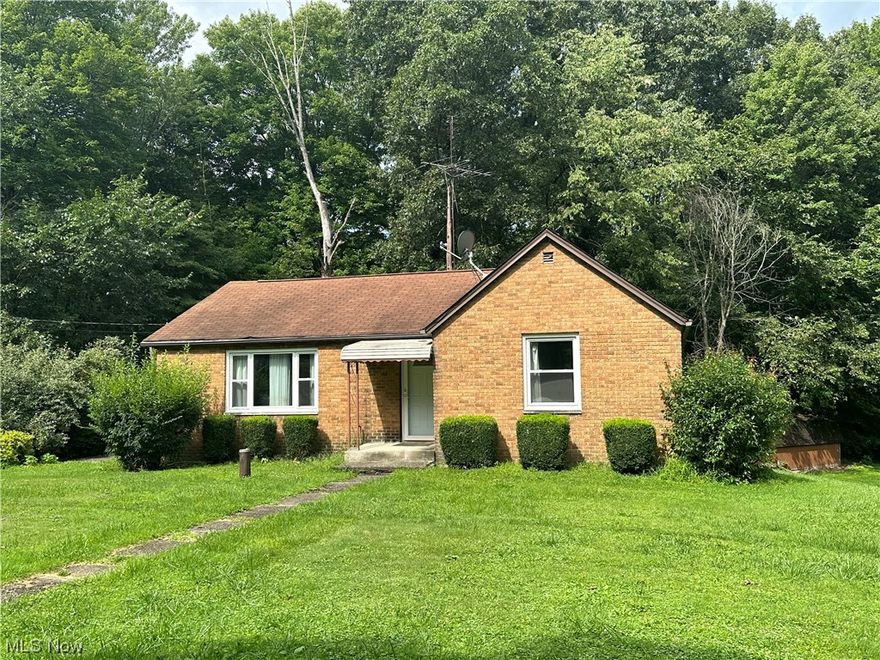 Are you looking for a Ranch home with acreage in Stark County? Look no further! This Excellent brick ranch is the one for you! Situated on 1.02 acres, this three bedroom home offers you a peaceful setting of both cleared and wooded acreage. Built in 1949, this home still maintains its  charm and hardwood floors!  Although much of the original character is still apparent, this home has had many updates, including the beautiful kitchen and bathroom that have recently remodeled! There are direct site-lines from the living room into the dining room, where you have full access to the back yard! Besides tranquility and the abundance of space, the back yard offers access to the attached garage and great sized shed. The basement has potential to be additional finished living space as well! Hurry to schedule a viewing today, this home won’t sit on the market long!
