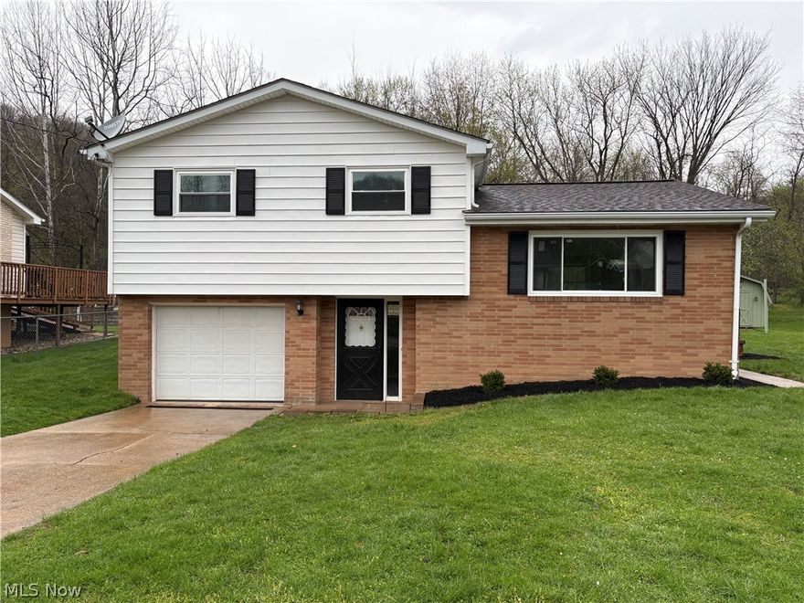 Modern, charming, and move-in ready, this beautifully updated 3 bedroom, 1 bath split-level home offers a perfect blend of style and comfort. Recent upgrades include brand-new windows (2026), six-panel interior doors, contemporary lighting, and ceiling fans throughout. The home also features newer appliances and plush new carpeting in both the living room and all bedrooms. The kitchen has been thoughtfully refreshed with white painted cabinets, a new countertop, sink, and faucet, and provides direct access to a side patio—ideal for relaxing or entertaining—complete with freshly painted black railing. The fully updated bathroom showcases new tub surround, toilet, vanity, fan, and modern lighting. Every room has been newly painted and enhanced with new outlets and switches for a polished, updated feel. Exterior improvements add to the home's curb appeal, including new landscaping, freshly painted shutters, power washing, new outdoor lighting, and new garage door opener. With its attractive half-brick, half-vinyl siding, this home offers both durability and contemporary style in a quiet neighborhood. Backyard is serene and holds potential for many possibilities. Call today to see this lovely home before it's gone!