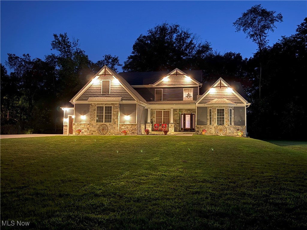 STUNNING 2024 CUSTOM BUILT COLONIAL - LUXURY LIVING AT AN UNBEATABLE PRICE. Why pay builder prices when you can have it all for less? Enter into 3,500+ sf (first and second floor) of nearly new construction that is priced below today's construction costs. This isn't just a house – it's your personal resort. The heart of this home is a show-stopping gourmet kitchen featuring a massive wraparound island perfect for morning coffee or hosting dinner parties. Watch conversations flow seamlessly into the soaring two-story great room, where a custom gas fireplace creates the perfect ambiance for every season. Escape to your first-floor primary suite – a true sanctuary with a spa-inspired bath and dual walk-in closets. On the second level there are three spacious bedrooms (one with a private full bath). A bonus room above the garage which could be a playroom or additional bedroom. The lower level features 1,800+ sf of finished space: 9-foot ceilings, an additional bedroom, full bath, an expansive recreation room, a stylish wet bar for entertaining, a dedicated theater area for movie nights, and a personal fitness room. Imagine summer evenings on your covered front porch or hosting barbecues on the spacious concrete patio. The oversized 3-car garage includes EV charging and convenient basement access. So many more upgrades – too many to list. This is a location that has it all. Nestled minutes from Cuyahoga Valley National Park's scenic trails, Brecksville Rec Center, Sleepy Hollow Golf Course, and ski resorts. The seller offers flexible move-in dates to match your timeline perfectly. This is your chance to own a custom-built luxury home for less than building costs. With a recent price reduction, an opportunity like this won’t last long. Schedule your private tour today – your forever home is waiting.