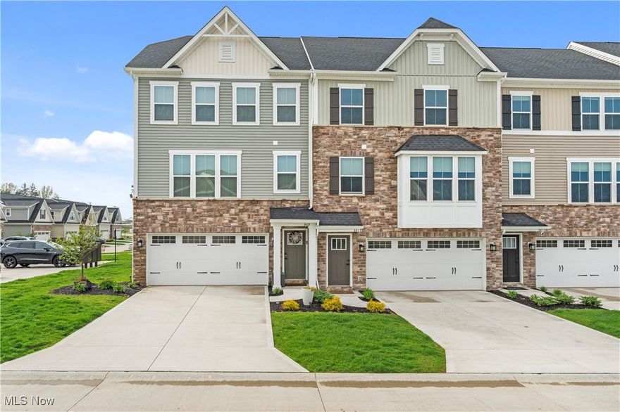 Welcome to The Links at Rosemont Greens! Nestled in one of Fairlawn’s most desirable communities, this stunning newer-build townhome offers modern living just minutes from premier Montrose shopping, dining, Summit Mall, Fairlawn Country Club, and major highways. Step inside to discover 9-foot ceilings and an open floor plan accented by upgraded luxury vinyl flooring, crisp white cabinetry, and elegant quartz countertops. The spacious kitchen is a true showstopper, featuring a massive center island, stainless steel appliances, and abundant storage—perfect for both everyday living and entertaining.  Upstairs, you’ll find a conveniently located laundry area near the bedrooms, including an oversized master suite with a tray ceiling and a generous en-suite bath. Enjoy two serene outdoor living spaces: a deck off the kitchen with tranquil pond views, and a walk-out patio from the lower level, ideal for morning coffee or evening relaxation. This home perfectly blends style, comfort, and convenience—don’t miss your opportunity to call it yours!