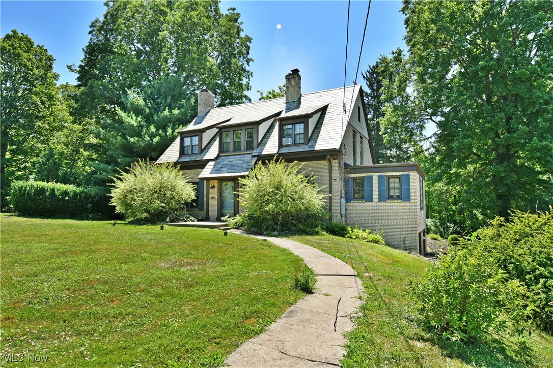 The Crown Jewel of Glenwood! This nearly 3,700 square foot, 5 bedroom estate sits deep on its lot with Mill Creek Park as its neighbor! Welcome home to 3726 Glenwood Ave! As you're welcomed by the home, take note of its beautiful slate roof and lovely landscaping. As soon as you enter, the quality craftsmanship of days gone by envelopes you. Incredible original hardwood floors fall underfoot which works in harmony with the untouched woodwork. A beautifully updated kitchen sits at the front of the home. Updated cabinetry, countertops, and appliances (2018) compliment the custom island and breakfast nook. Just beyond is a large formal dining room perfect for an elegant dinner party or laid back game night. Adjacent to the dining room is an inviting home office/bedroom complete with ensuite powder room. Moving across the large center hall, is the expansive living room. An eye catching wood burning fireplace makes the perfect centerpiece to the large gathering spot. From here, spend your time relaxing in the cozy three season room! An inlaw suite with full bath and kitchenette is accessible from here and the rear deck making it ideal for extended family or additional income! Upstairs 2 well sized bedrooms join an oversized main bedroom with walk in closet and a gorgeous full bath! The full basement offers mechanicals, storage opportunities, laundry services, and access to the built in 2 car garage! The backyard is a true respite offering lounging spaces on the deck as well as a patio and separate firepit area against the woodline of the park. There is even a pathway that leads directly into the park for easy access! Whether you're looking for the perfect home or an incredible addition to your investment portfolio (this home is currently used as a cash flowing, shared space, AirBnB) this stunner is sure to impress! Call today for your personal tour!