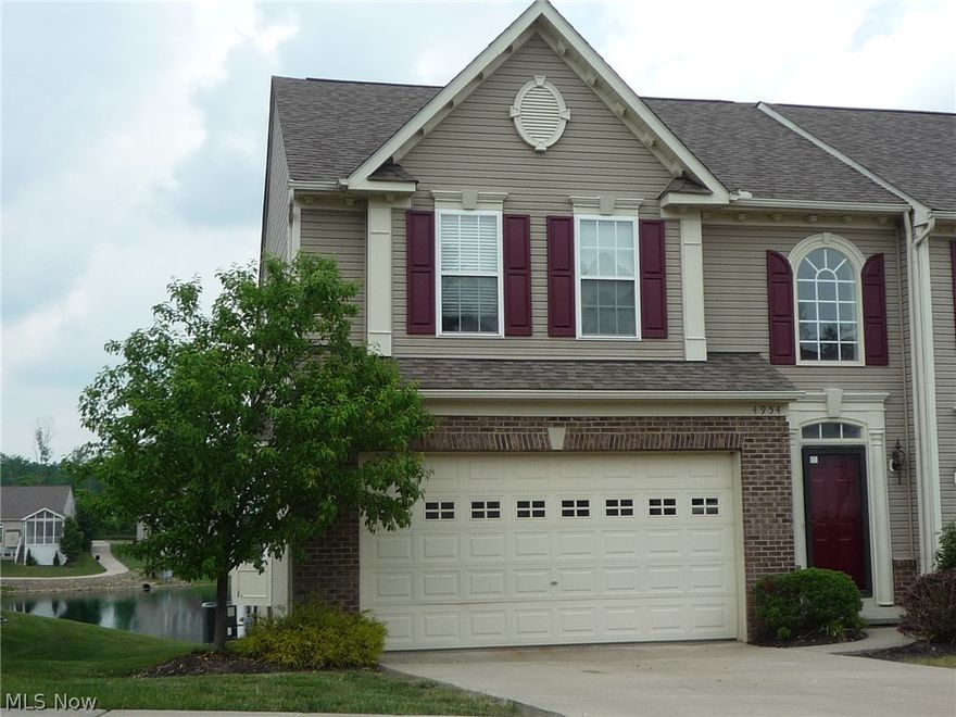 Beautiful and Spacous Colonial attached Home in Hidden Lakes.  Terrific Lake view!  Hudson Schools!  This unit has a full walk out finished lower level.   Main level deck, and lower level Patio. Fresh neutral paint throughout, and new carpet as well.  Hardwood floors through much of the home. A wall of windows from the great room gives you that peaceful lake view year round!  Nice Kitchen with granite countertops. New High Efficiency Furnace.  Don't miss out on this great home. This is a Fannie Mae HomePath Property.