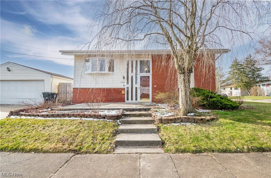 Welcome to 2440 Cooledge Avenue! Don't miss this 4 bedroom, 2 bathroom bi-level home in Ellet! Enjoy your main level boasting hardwood floors, vaulted ceilings, and large windows providing natural light throughout. Your kitchen offers 2020 stainless steel appliances and a new faucet. Two bedrooms are conveniently located on the main level. Spend your evenings next to your cozy fireplace in the family room or entertaining in your private backyard. The additional two bedrooms, full bath, and laundry room round out the lower level. The kitchen and dining room grant access to your fully fenced-in backyard featuring a detached 2 car garage and storage shed. 2 of the 4 bedrooms have brand new carpet. Roof 2012. Furnace/AC spring 2022. HWT 2021. Schedule your private viewing today!