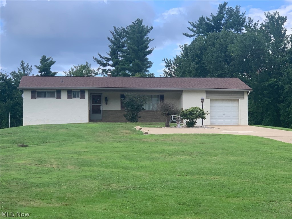 Ranch home sitting on almost 1 acre of property. Home does need updated but has been well maintained by one owner. Spacious living room with oversize picture window, eating kitchen with sliding door to back patio. Based on wood floors in closets, we believe there is hardwood floors under living room and bedrooms but do not know condition. Poured concrete pad with basketball hoop and shed in back yard. Cover front porch with nice landscaping and a poured concrete driveway. Newer roof and HVAC. #1569
