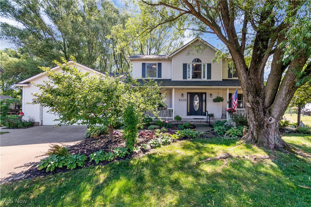Welcome to this pristine colonial where timeless charm meets modern comfort in one of Uniontown’s most desirable neighborhoods—Clearwater Commons! Nestled on nearly three-quarters of an acre, this beautifully maintained home offers the perfect blend of space, style, and setting. From the moment you arrive, the inviting front porch, curb appeal, and mature landscaping set the tone for what awaits inside. Step through the front door into a light-filled, thoughtfully designed layout—perfect for both everyday living and entertaining. The heart of the home is the kitchen, featuring stainless steel appliances, abundant cabinet space, and an amazing view from the sink area. The spacious family room boasts a stunning brick masonry fireplace and French doors leading to the living room, creating a warm, connected flow. The oversized dining room is conveniently located adjacent to the kitchen with chic lighting. A large laundry/mud room provides convenience and direct access to the backyard. The bonus room on the first floor could be used as a home office, playroom or den. Upstairs, the vaulted primary suite feels like a private retreat with a walk-in closet, soaking tub, and private bath. Three additional bedrooms offer plenty of space for family and guests with a hall bath nearby. The partially finished basement expands your living space with a large recreation area and generous storage. Outdoor living shines here—relax on the oversized back patio with endless views or host summer barbecues in the expansive backyard. Enjoy the peace of a friendly neighborhood while being just minutes from schools, shopping, and parks.This is more than a house—it’s the place where your next chapter begins. Don’t miss your chance to make it yours!