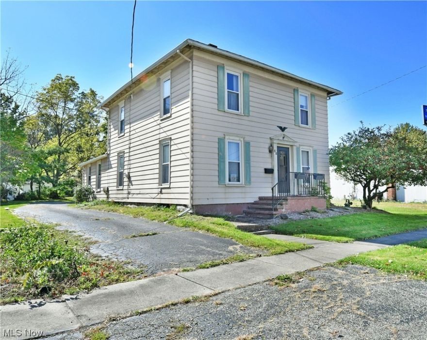 Start your next adventure off right with this move-in-ready Newton Falls residence! Offering a spacious, three-bedroom layout across two floors of living space, this home makes all the right moves. The deep-set lot is located on a quiet side street, just seconds from the quaint shops of downtown. A blacktop drive stretches past the home to find a detached two car garage with second story loft storage, an excellent opportunity for guest living, entertainment-friendly bar area, rec space, or workshop. The rear of the home includes a lattice-veiled, covered rear patio for casual privacy. Wrought iron lined steps lead to the front door, opening to a formal foyer and living room complete with lush carpets and a sculpted wood threshold to partition off parlor space. Formal dining awaits just steps past with its swing-away doors and direct kitchen access for serving. The kitchen itself enjoys a prominent center island and walk-in pantry storage. A short hall brings a half bath before spilling into the rear family room where hidden first floor laundry access is located amongst the stylish woodwork. Upstairs, a cabinet-lined hall branches from the landing as a full bath joins a trio of colorful and nicely sized bedrooms. Updates include: shingled roof 2018, flat roof 2020, vinyl replacement windows 2007, hot water tank 2007, and furnace 2007. Plus a one-year home warranty!