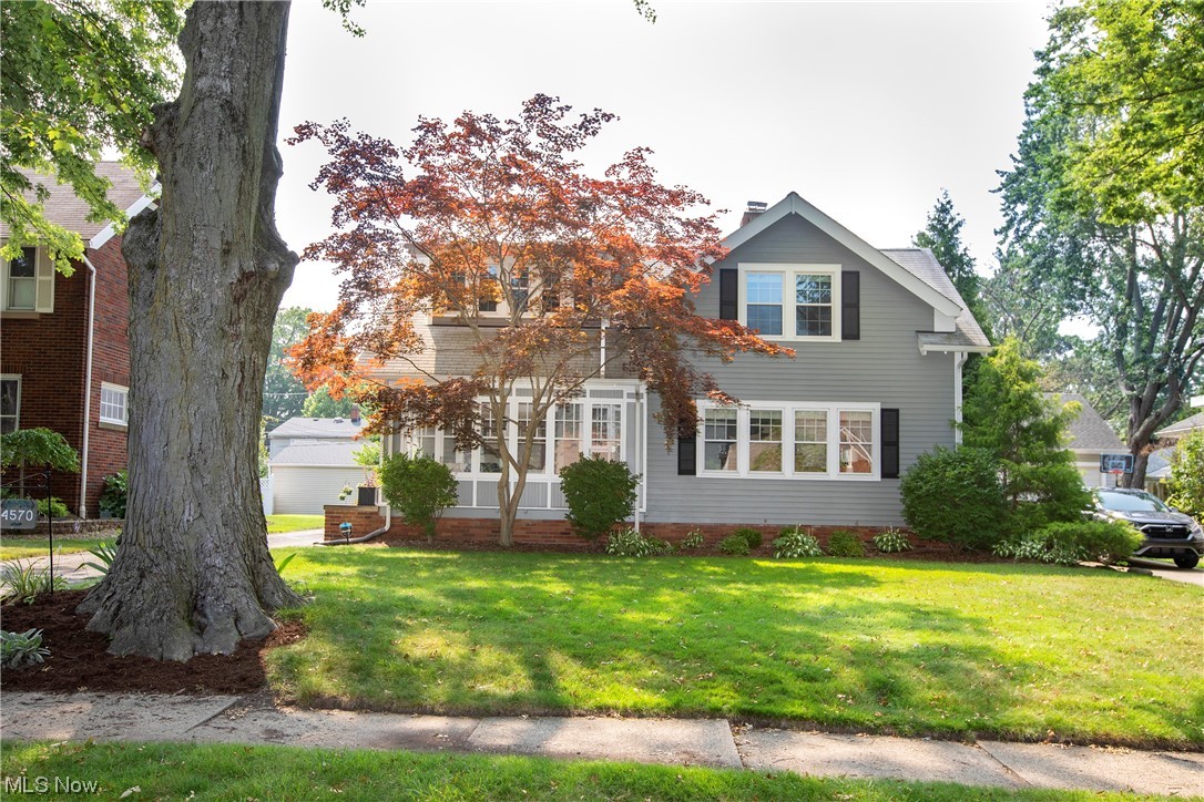 Get A Move On! This beautiful cape cod home offers character, updates and charm in every room! Original details blend well with modern updates. Hardwood floors and gorgeous woodwork await. The enclosed front porch draws you in and the first step into the spacious living room and formal dining room will not disappoint! Abundant windows pour natural light into this warm, welcoming home. Updated kitchen with great cupboard and counter space, plus sliding doors to the large brick rear patio. Note the 1st fl bedroom and updated full bath! Upper level boasts a huge primary bedroom suite, updated full bath, large 3rd bedroom, built-in storage, and lots of closet space. Relax/entertain on the brick patio and enjoy the private backyard with beautiful landscaping. Bonus! The 2.5 car garage is huge and has a large walk-up attic/loft just waiting to become an office, studio, apartment, etc. What a value! Call now for your private showing. A true Fairview gem just south of Lorain Rd!