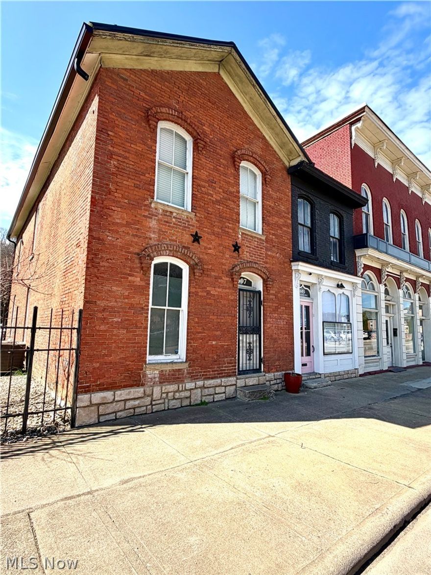 AGENT OWNED
Unique opportunity to own a beautifully updated mixed-use property blending residential comfort with commercial potential. This historic brick building is full of character while offering modern updates throughout.
The residential portion features 4 bedrooms and 1 full bathroom, providing ample living space. Attached to the home is a commercial suite currently operating as a hair salon, complete with its own private entrance, half bathroom, mini-split for heating and cooling, and a dedicated breaker box—ideal for a variety of business uses or rental income potential.
The exterior offers a fully fenced yard, a spacious side lot, and a private driveway for convenient access and parking. Enjoy outdoor entertaining on the large rear patio, perfect for guests or hosting.
Whether you are looking to run your business from home or invest in a versatile income-producing property, this one-of-a-kind space offers endless possibilities.