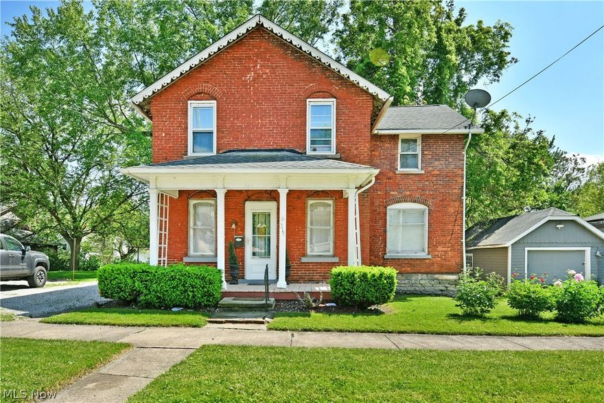Two stories of beautiful, all-brick living await this engaging Niles home! This semi-historic home is set just moments from the bustling attractions of downtown shopping and dining alike, all while providing its oversized lot that proudly displays its rich heritage and handsome looks. A pillar lined and covered front porch adds to the curb appeal as tidy landscaping joins a large storage shed sitting nearby. Around the back, a covered patio overlooks the natural backstop, taking full advantage of the tree provided shade. Inside the residence, each room delights with color, personalized touches and plenty of style that aligns with the vintage home’s appeal. The formal front entrance opens to a brightly lit living room where natural light spills across the hardwood flooring below. A sculpted chair rail runs along the near wall, adding to the attraction. Around the corner, a central dining room invites with bold colors and a hidden first floor half bath. Prepare your favorite meals in the surprisingly spacious and versatile kitchen, boasting wrapping countertops, stainless appliances and first floor laundry services that sit outside of additional bar top dining. Upstairs, a deep-set full bath greets you at the landing while the elegantly appointed master bedroom branches away from across the hall. Two additional bedrooms include a larger rear room, each with ample closet space. A full basement resides below for storage.