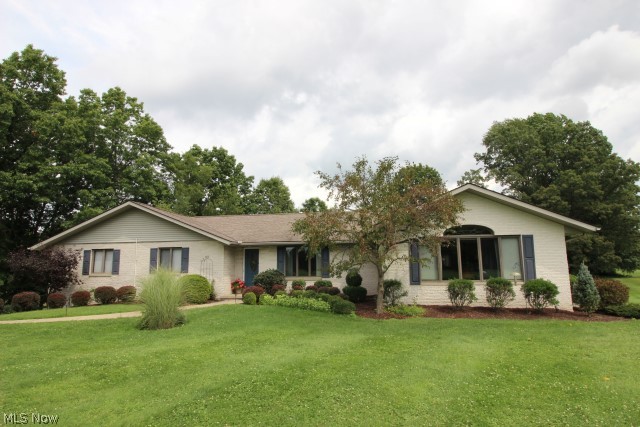 One of a kind! Lovely 3 bedroom, 2.5 bath ranch w/3106SF incl finished walkout lower level on private 1.19 acres w/tranquil views of the Tuscarawas river* Vaulted Great room w/walls of windows overlooking the beautiful setting, surround sound & access to deck* Formal dining* Oak eat in kitchen w/breakfast bar, desk, roll out shelves, double built in oven & wood floor* Spacious master w/walk in closet & updated master bath* Family room w/brick wall fireplace (gas log or wood burning) & slider to brick patio/deck w/built in seating* Office w/walk in storage closet* Laundry w/cupboards, desk, folding area & sink* Mud room* Heated 2.5 car garage* Unfinished basement/workshop area w/double doors to covered patio* 16x24 heated barn w/220V* 30 yr shingles (2000)* Septic (2000)* Well pump & pressure tank (2012)* Reverse osmosis* Softener* Home warranty provided*