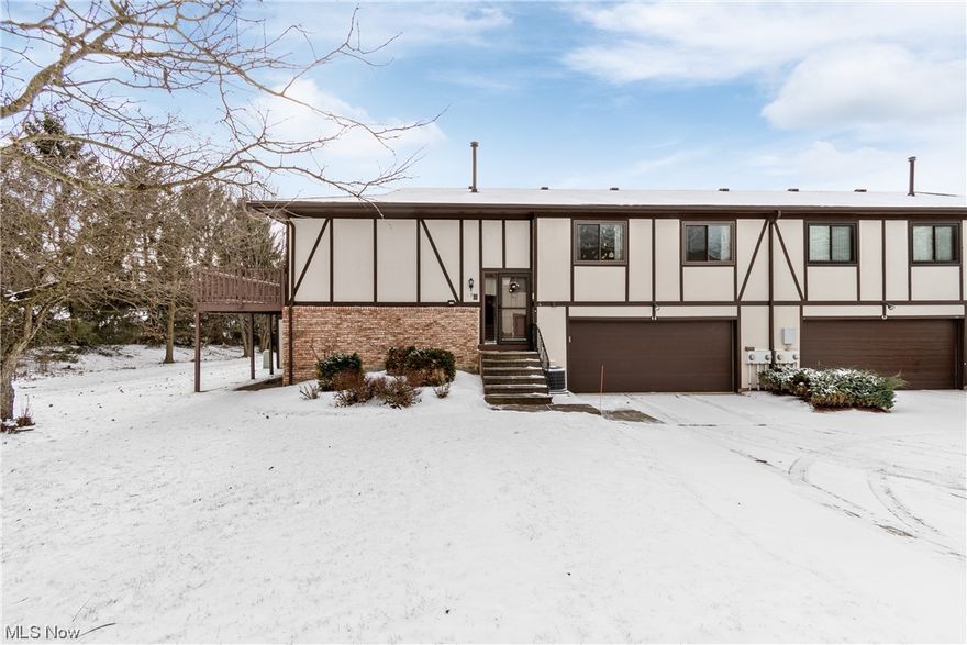 Must see End-Unit condo that has so many updates! This unit is perfect for relaxing or entertaining!  Main level has an open concept floor plan with a spacious living room which is open to the dining area and kitchen, and beautiful wood flooring laminate.  The kitchen features counter sitting for quick a snack or breakfast.  Appliances do convey.  Relax on the oversized deck of the main level.  The finished lower level provides a beautiful family room, full bath and laundry room.  The lower level/basement walks out to a covered patio surrounded by woods.  This home is situated in a great location.   HOA includes a picnic area, inground pool & campfire space. Call today for a private showing!