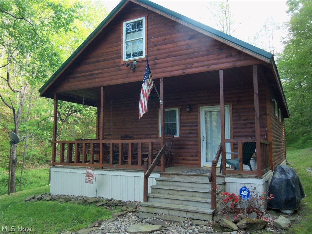 Move right in everything you need is included, Built as a retreat or hunting camp. Cabin is well built with an open floor plan. two loft areas 8 x 21 one is currently used for sleeping quarters with 2 half beds overlooks great room. Main sleeping area 8 x 14 has king sized bed and is open to great room area could be easily enclosed. Bath with a shower. 200 amp service, gas space heater for heating. Great room includes living room and kitchen furniture and appliances. Trails thru out the 40 wooded acres that backs up to Wayne National Forest. Elem: Frontier Elementary Elem/Bus: Y JrHigh: Frontier Middle JrHigh/Bus: Y High: Frontier High School High/Bus: Y Fire: VOL Police: SHF PossFreeGas: N ;SQFT=Fin Above:872, Fin Total:872, Unfin Above:0;PRKG= Off Street