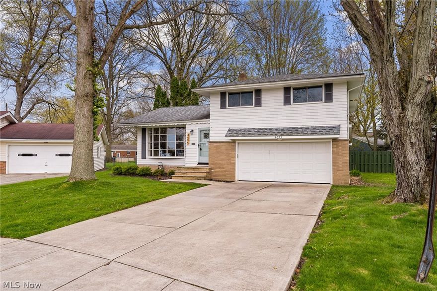 Welcome to your ideal home in Fairview Park!  Conveniently located on a quiet street close to shopping and restaurants.  This charming split-level home offers three bedrooms, one and a half baths, and all the updates you are looking for! Walk in to the bright and spacious living room and dining room, filled with natural light, gleaming hardwood floors and a beautiful new fireplace.  The recently remodeled kitchen comes loaded with plenty of storage and cabinetry, quartz countertops, a large breakfast bar with butcher block counters, tile backsplash, and stainless-steel appliances.  The lower-level family room boasts new luxury vinyl floors, plenty of room for lounging or entertaining, a convenient newly updated half bath, and access to the huge covered patio!   The second floor has 3 very spacious bedrooms with ample closet space and a full bath that has been recently updated with heated tiled floors, new vanity and lighting, and subway tile tub surround.  This split-level also has a true basement with additional finished room perfect for home office or workout area along with an unfinished side for laundry and storage.  Enjoy the two car attached garage and massive, fully fenced back yard!  Don't miss this very special home!