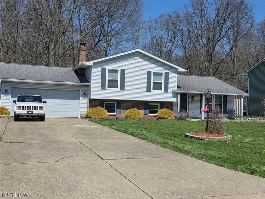 Spacious split level located against Mill Creek Park...lot's of privacy. 3 bedrooms 2 full baths.  Sound system in the family room stays.  Some siding ws replaced in 2017.  Front windows have been replaced.   2 car garage with pull down attic access.  Shed and a patio under the snow.