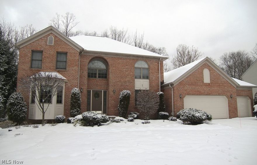 Welcome to this impeccably maintained and beautifully landscaped brick front colonial with a three car garage and a private fenced backyard. The foyer offers hardwood flooring and leads to a private library/office and the formal living and dining rooms. The spacious kitchen has an abundance of cabinet and counter space including a center island with a breakfast bar, all appliances and a separate eating area with atrium doors to the custom deck and backyard. Open from the kitchen is the generous family room with a cathedral ceiling and a woodburning fireplace offering great entertaining space. There are four spacious bedrooms and two full baths on the second floor. The large master suite features a full glamour bath with a whirlpool tub, double sinks and a separate shower plus a generously sized walk in closet. The full basement is ready for your design and finishing with plenty of room for storage. This house is in move in condition and within walking distance to the park, playgrounds,